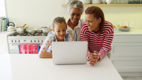 Mother-and-daughter-using-graphic-tablet-while-looking-at-laptop-4k