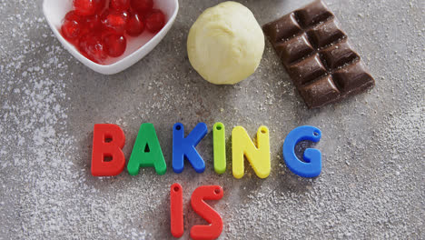Various-baking-ingredients-and-alphabet-forming-baking-is-fun-4k