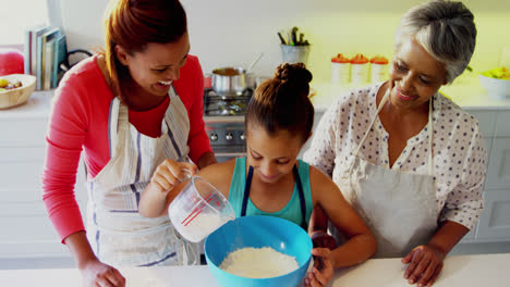 Happy-multi-generation-family-preparing-cookies-in-kitchen-4k