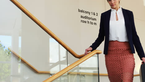 Businesswoman-walking-down-stairs-4k