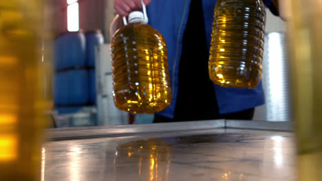 Olive-oil-can-being-kept-on-table-in-oil-factory