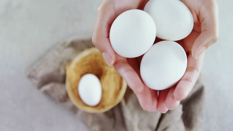 Woman-holding-white-eggs-4k