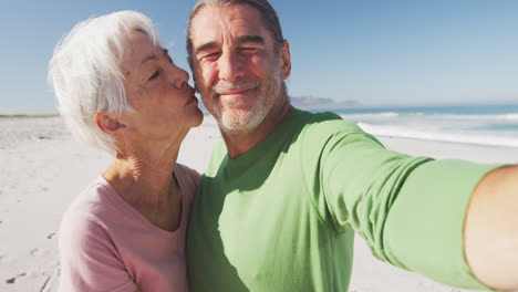Senior-Caucasian-couple-enjoying-time-at-the-beach