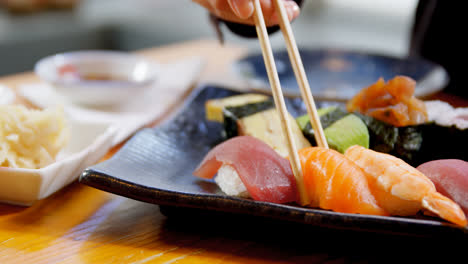 Woman-having-sushi-in-restaurant-4k
