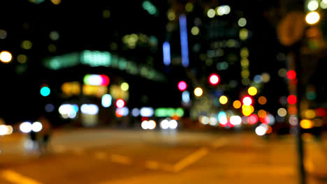 Colorful-bokeh-of-car-lights-at-traffic-signal-on-street-at-night-4k