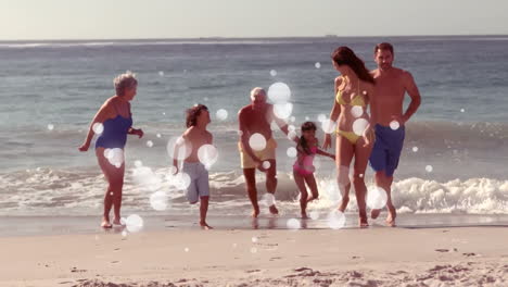 Moving-spots-of-white-light-with-family-on-beach