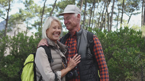 Front-view-of-active-senior-couple-in-forest