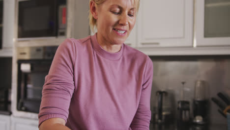 Front-view-of-Caucasian-woman-cooking-at-home