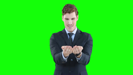 Caucasian-man-raising-hands-on-green-background