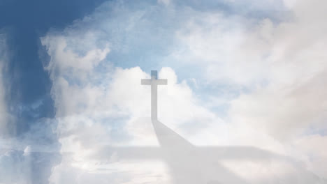 Animation-of-silhouette-of-Christian-cross-casting-shadow-over-clouds-moving