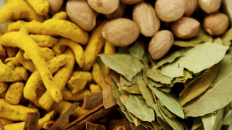 Nutmeg,-bay-leaf,-cinnamon-stick-and-turmeric-4k