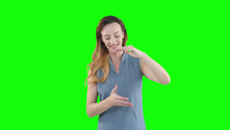 Caucasian-woman-raising-hands-on-green-background