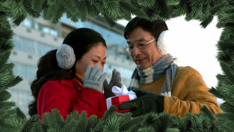 Christmas-tree-border-with-couple-giving-gift