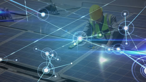 Animation-of-network-connectionS-over-a-worker-installing-solar-panels