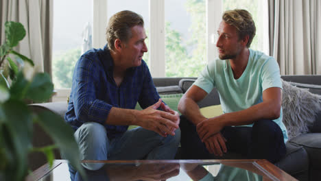 Caucasian-man-with-his-father-discussing-together-at-home