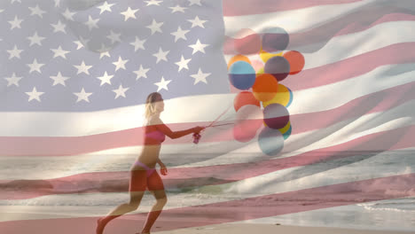 Woman-holding-balloons-in-the-beach-and-the-American-flag-for-fourth-of-July.