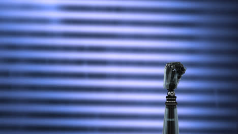 Robot-arm-on-a-striped-background