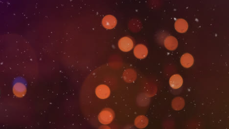 Digital-animation-of-snow-falling-over-orange-spots-of-light-against-black-background