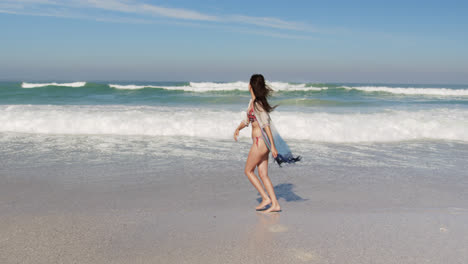 Young-woman-having-fun-at-beach-4k