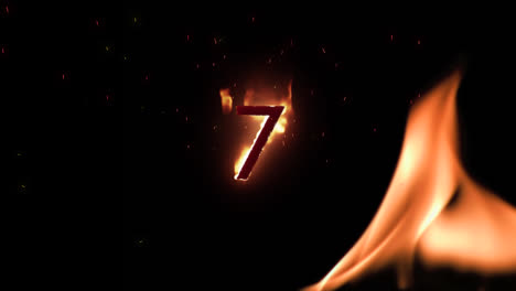 7-in-flames-on-black-background