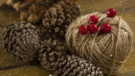 Falling-snow-with-Christmas-pine-cones-decoration