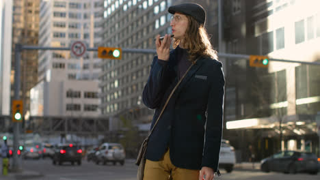 Side-view-of-young-Caucasian-man-talking-on-mobile-phone-in-the-city-4k