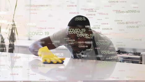 Covid-19-Und-Virustext-Gegen-Den-Mann,-Der-Putzt-Und-Sprinkler-Benutzt