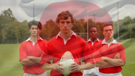 Jugadores-De-Rugby-De-Pie-En-El-Campo-Con-Bandera-Japonesa-