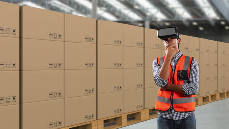 Caucasian-man-wearing-an-orange-high-vest-and-hat-with-3D-virtual-googles-in-a-warehouse-area-