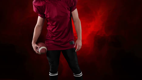 Male-rugby-player-against-red-background