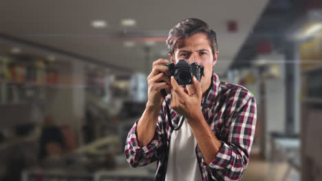 Caucasian-male-taking-pictures-and-smiling-at-the-camera