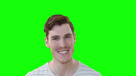 Caucasian-man-smiling-at-camera-on-green-background