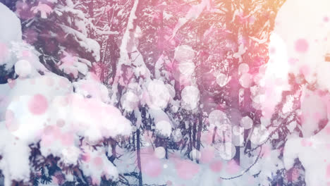 Digital-composition-of-pink-glowing-spots-of-light-against-snow-landscape-with-trees