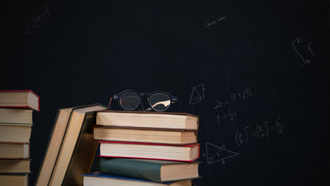 Eyeglass-on-a-pile-of-books-and-mathematical-equations-with-figures