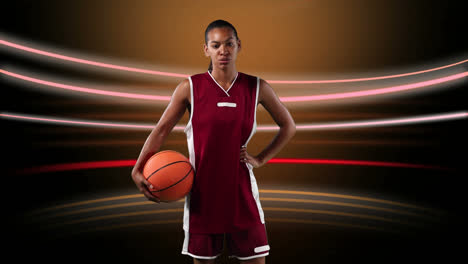 Female-basketball-player-against-light-trails-on-black-background