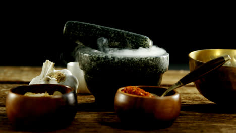 Various-type-of-spices-in-bowl-with-mortar-and-pestle-4k