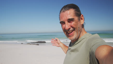 Senior-Caucasian-man-enjoying-time-on-the-beach