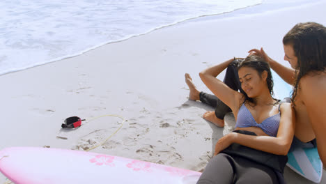 Surfer-couple-relaxing-on-the-beach-4K-4k