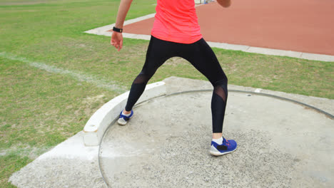 Low-section-of-female-athlete-practicing-javelin-throw-at-sports-venue-4k