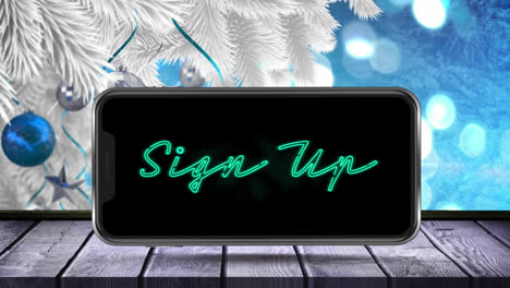 Animation-of-sign-up-text-on-smartphone-screen-with-christmas-tree-on-blue-background