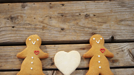 Gingerbread-cookies-arranged-on-wooden-table-4k