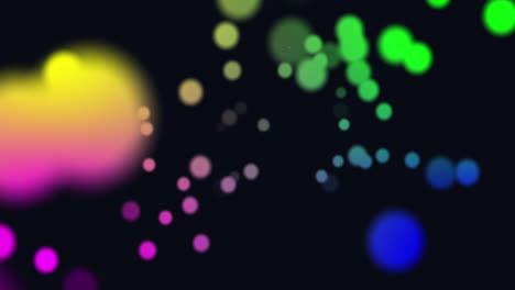 Animation-of-multi-coloured-glowing-spots-of-light-moving-in-hypnotic-motion-on-black-background