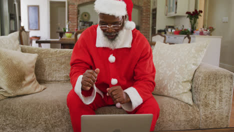 Senior-man-at-christmas-time-wearing-santa-costume