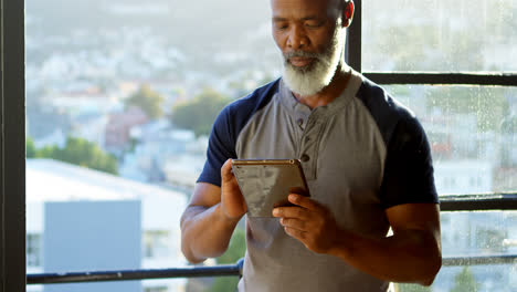 Senior-man-using-digital-tablet-at-home-4k