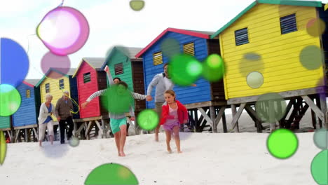 Puntos-De-Luz-De-Colores-En-Movimiento-Con-La-Familia-En-La-Playa
