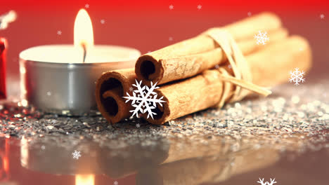Digital-composition-of-snowflakes-falling-against-burning-candle-and-cinnamon-sticks