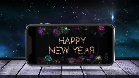 Digital-animation-of-happy-new-year-text-and-fireworks-exploding-on-smartphone-screen