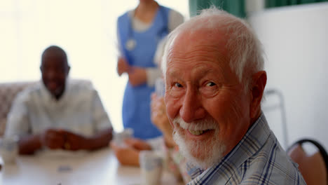 Side-view-of-active-Caucasian-senior-man-sitting-in-the-nursing-home-4k
