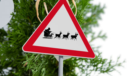 Digital-animation-of-santa-claus-in-sleigh-being-pulled-by-reindeers-on-signboard