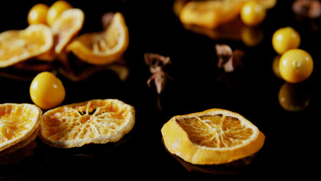 Sweet-lemon-and-cape-gooseberry-on-black-background-4k
